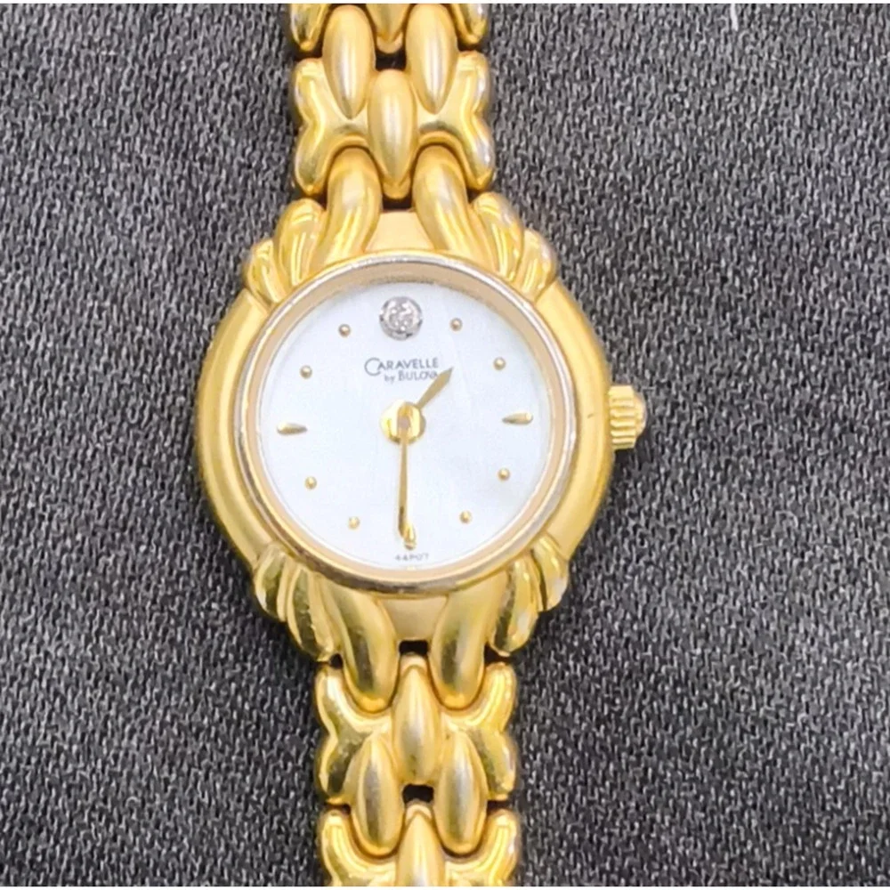 Caravelle by Bulova 44P07 women's Watch Gold Tone Round White Face #W5153